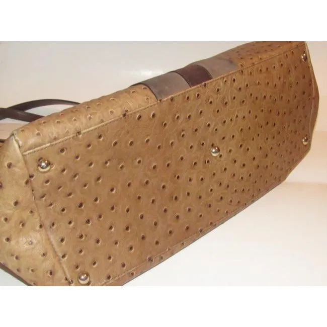 Furla, two handle, tote bag made of a fabulous, brown ostrich embossed leather and suede striped center in shades of burgundy